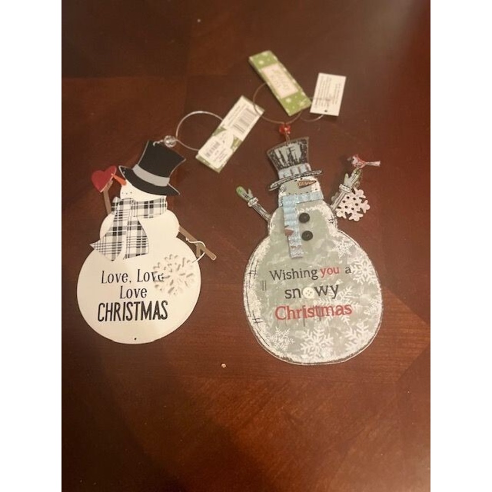 Two metal Snowman Christmas Hanging Decorations with festive holiday messages